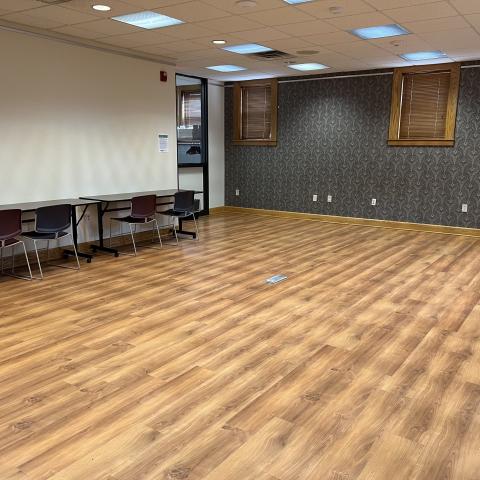 Image of the Gerber Globe Valve Program Room. Room has vinyl plank flooring and movable tables and chairs.