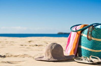 Beach photo w/ bag, hat, towel & sunglasses