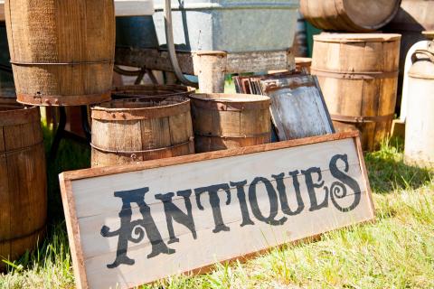 wood barrels w/ antiques sign leaning at front