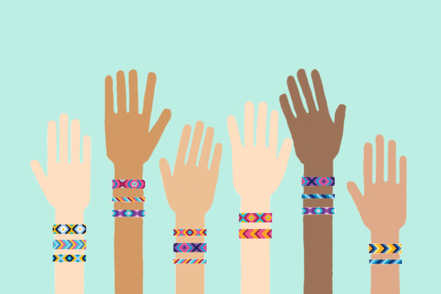 Hands in the air with friendship bracelets 