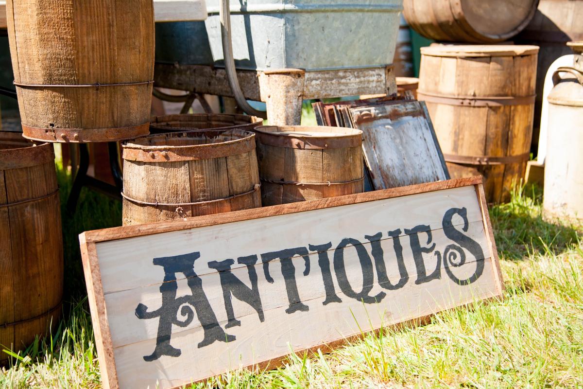 wood barrels w/ antiques sign leaning at front